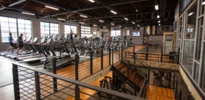 interior image of upstairs at qntm fit life with rows of treadmills and ellipticals